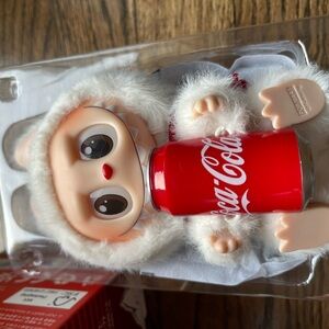 The Monsters Coca-Cola Vinyl Face Happy Factor NIB open from bottom resealed